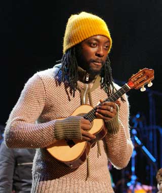Will.I.Am holding a uke